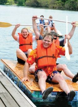 people riding a milk carton on Green Lake