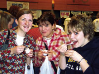 Group of people sampling new foods at Vegfest 2003.
