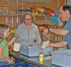 Volunteers packaging food