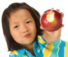 kid girl holding apple