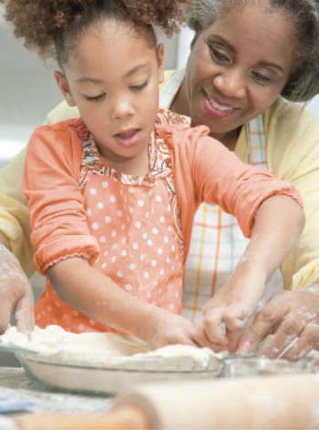 child cooking with mother