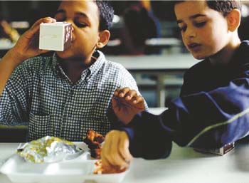 Image of school children eating lunch. From the cover artwork for the February 2004 Sound Consumer