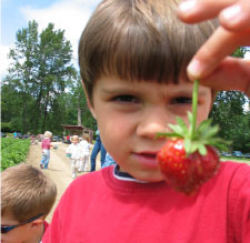 child w/strawberry