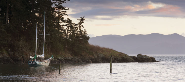 Sailboat along Puget Sound coast