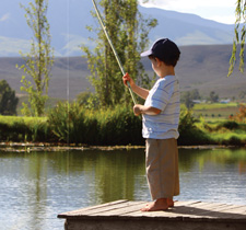 boy fishing dock