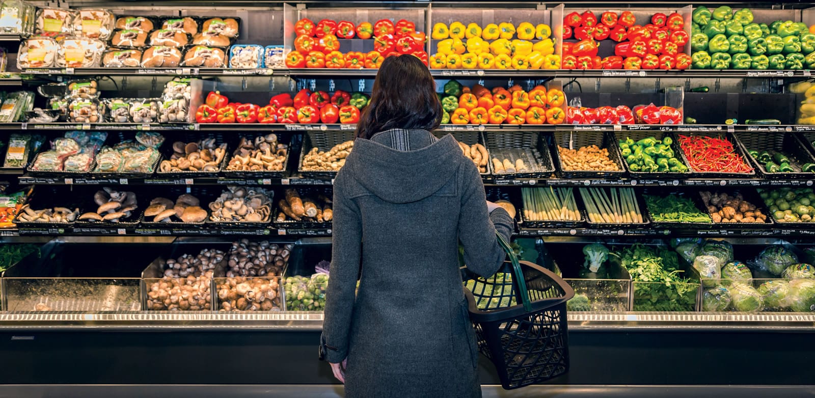 woman produce wet rack