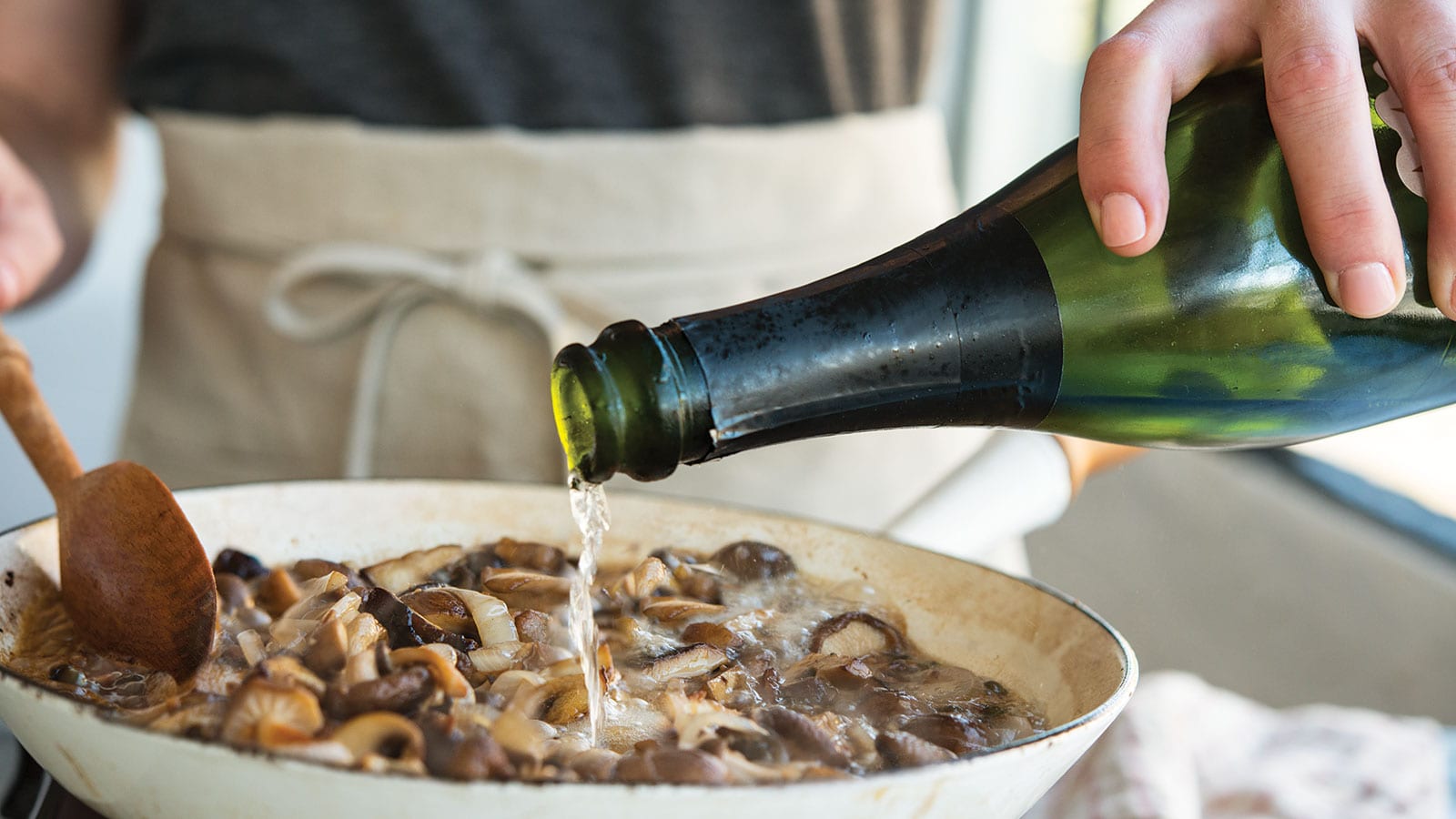 champagne pouring into skillet