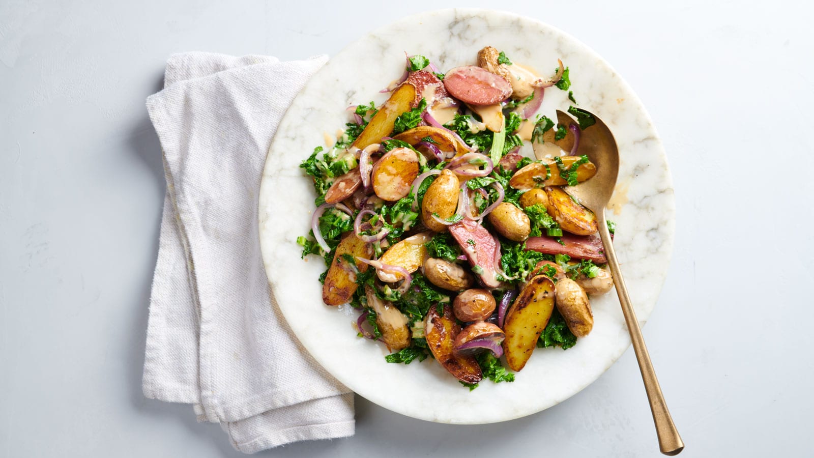 Roasted Fingerling Potato Salad With Mustard Greens And Tahini Dressing Roasted Fingerling Potato Salad With Mustard Greens And Tahini Dressing