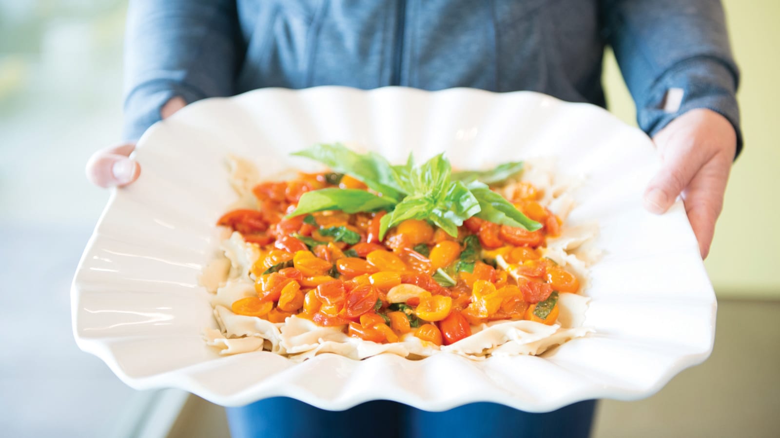 PCC Cooks dish of pasta with basil and tomato sauce.