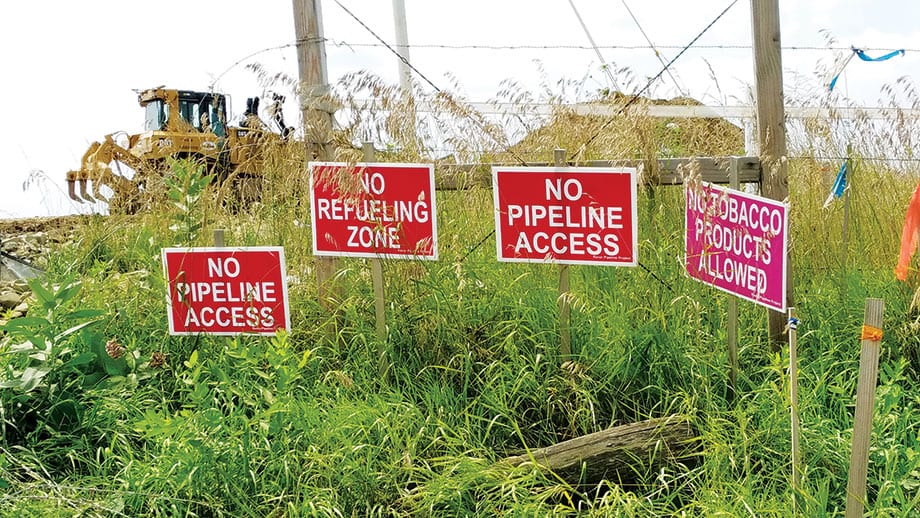 Pipeline protest signs outside James Yoder's farm.