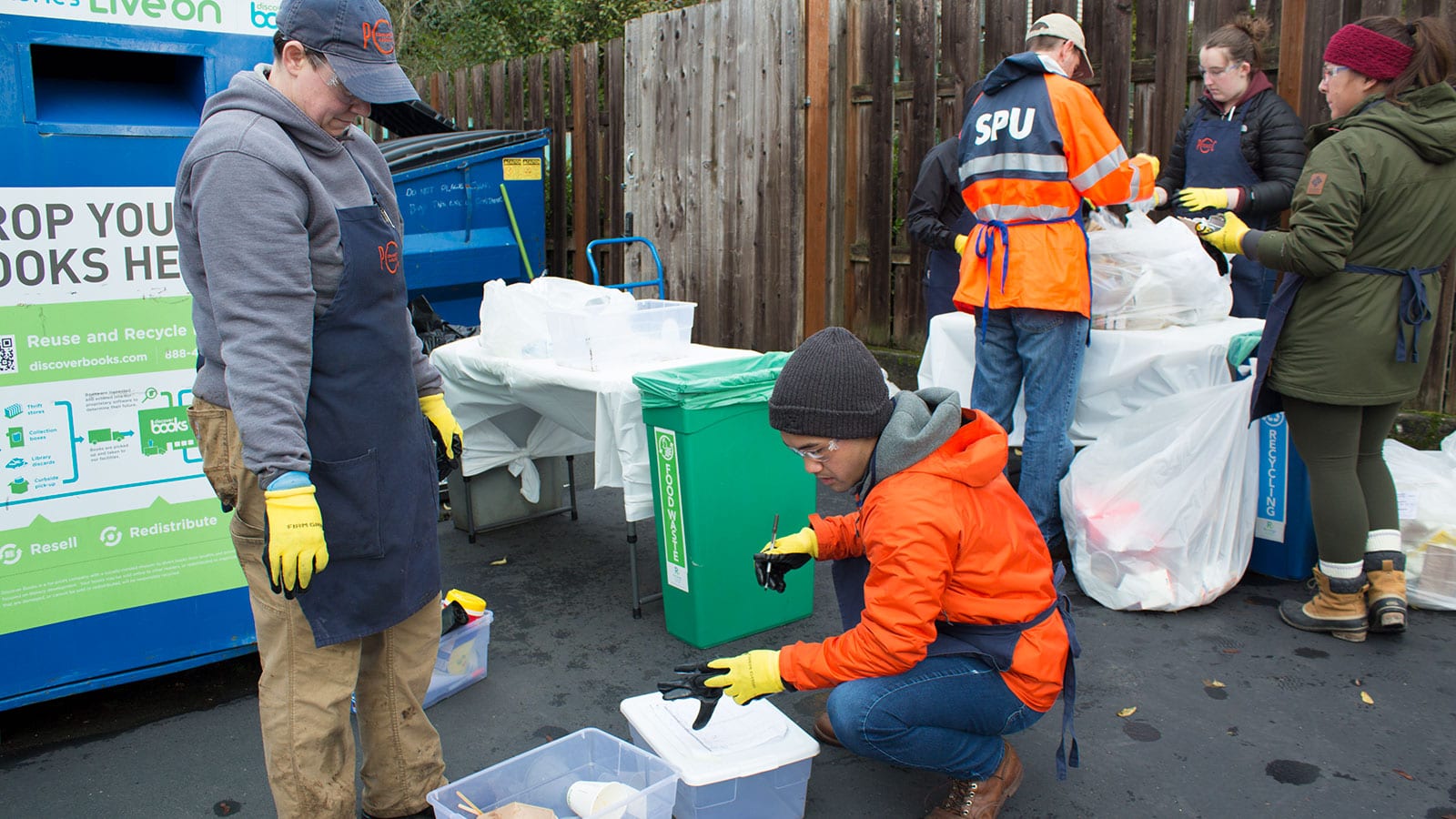 Brent Kawamura, senior sustainability specialist at PCC Community Markets, works with the team at View Ridge PCC to conduct a waste audit.