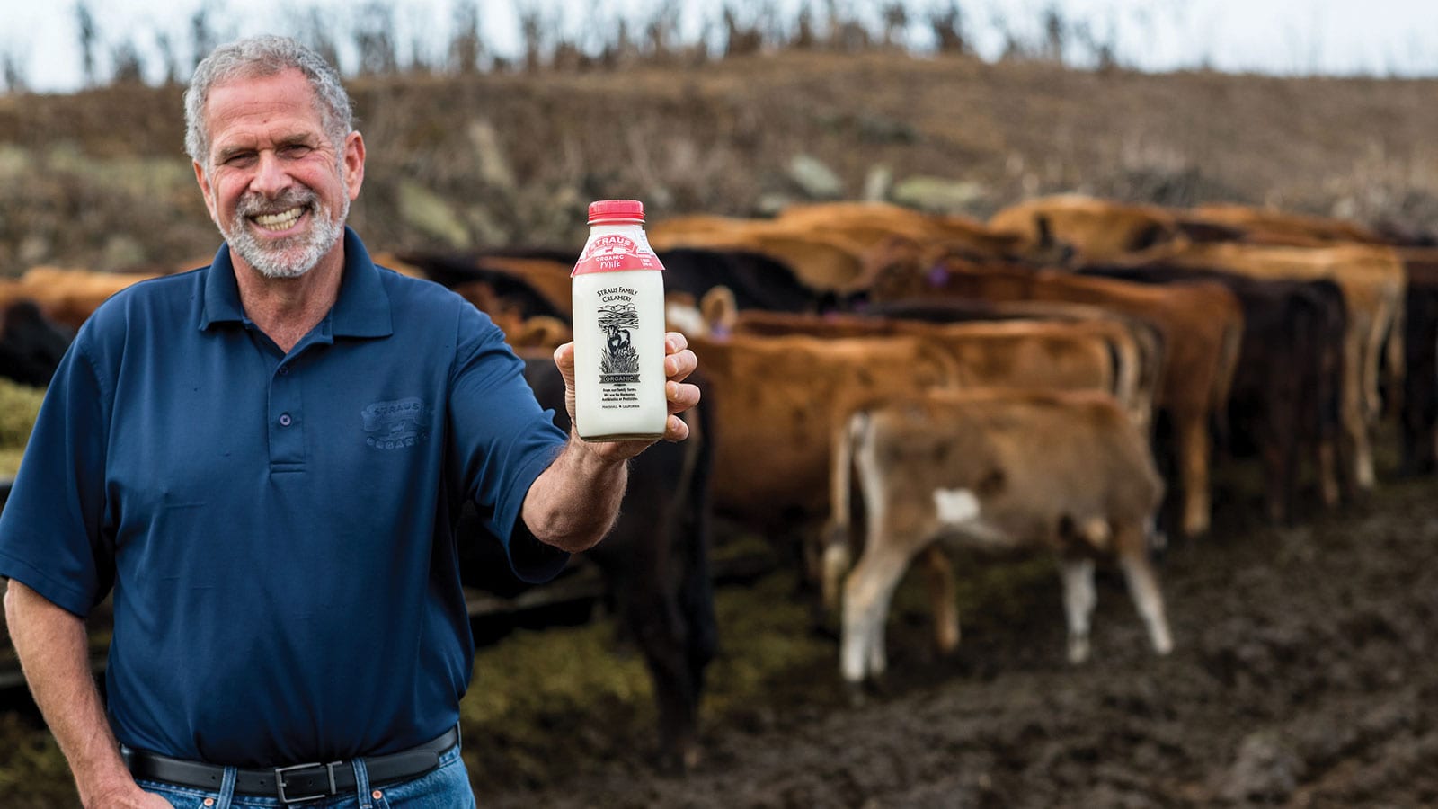 Founder/CEO Albert Straus holding a bottle of Straus Family Creamery organic milk.