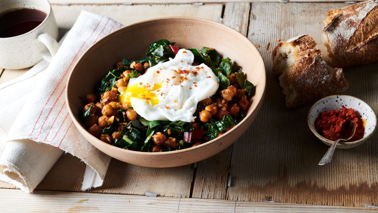 Seared Harissa Garbanzo Beans with Greens and Poached Egg