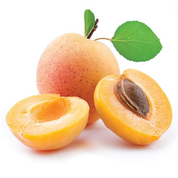 Apricots on a white background cut in half.