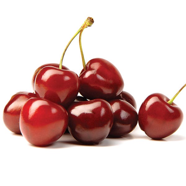Pile of red cherries on a white background.