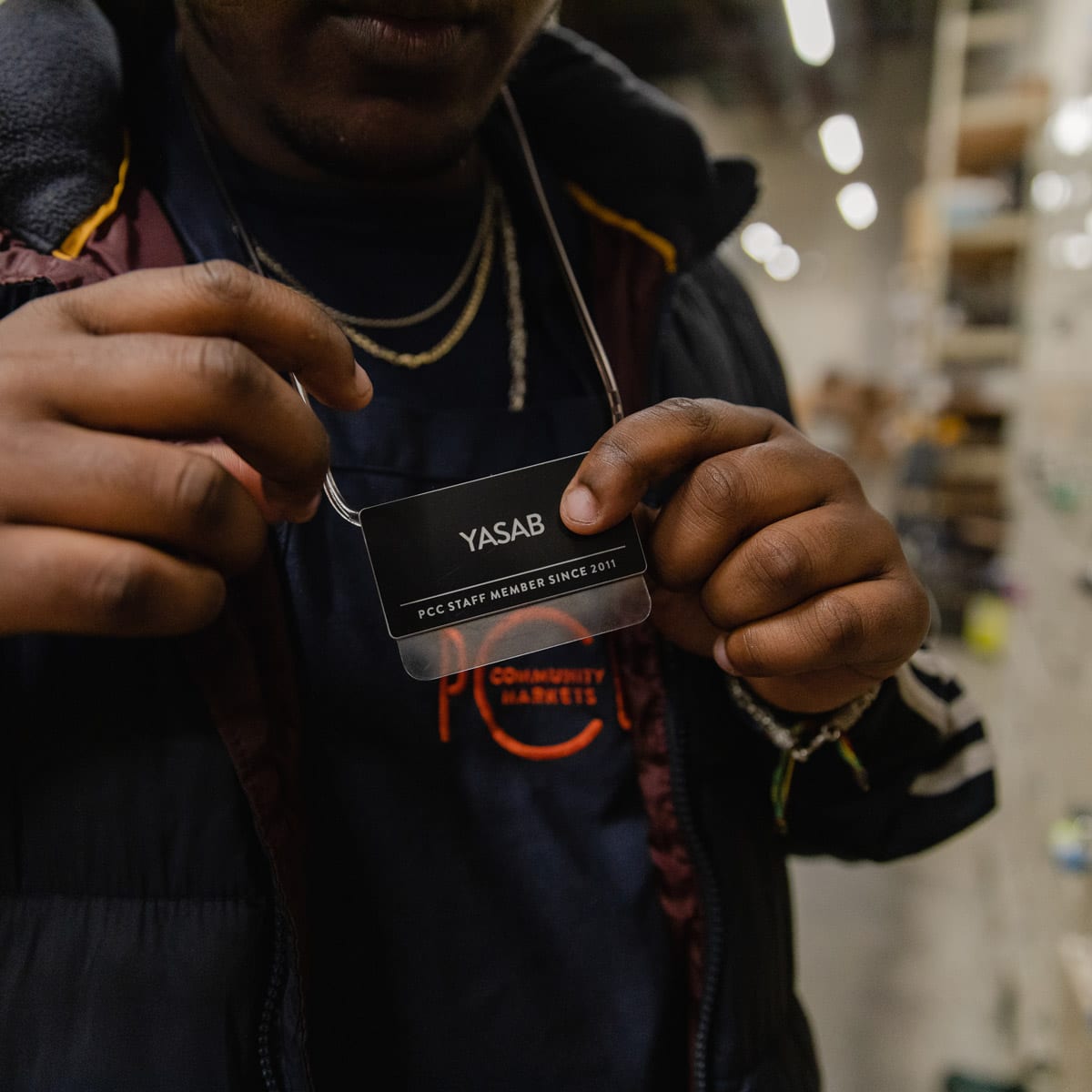 Yasab putting on nametag