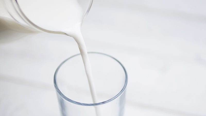 Milk pouring into a glass.