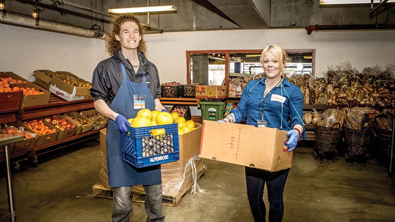 Happy workers of the Pike Place Market’s food bank. Photo by Rosemary Dai Ross.