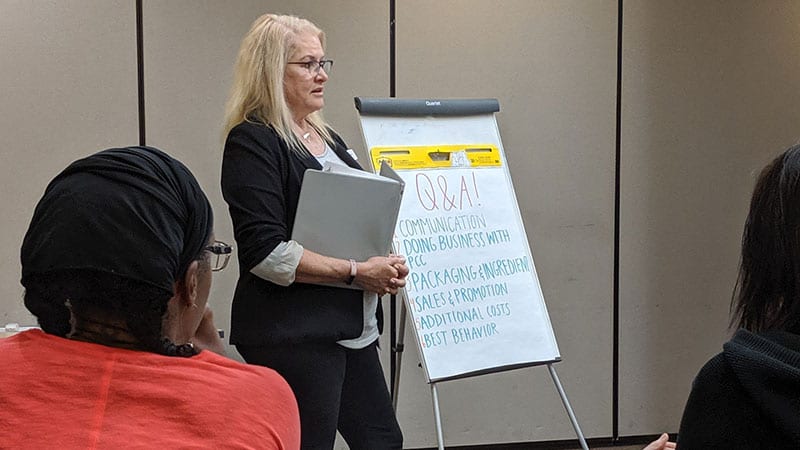 Betsy Earl speaking at a conference for Ventures.