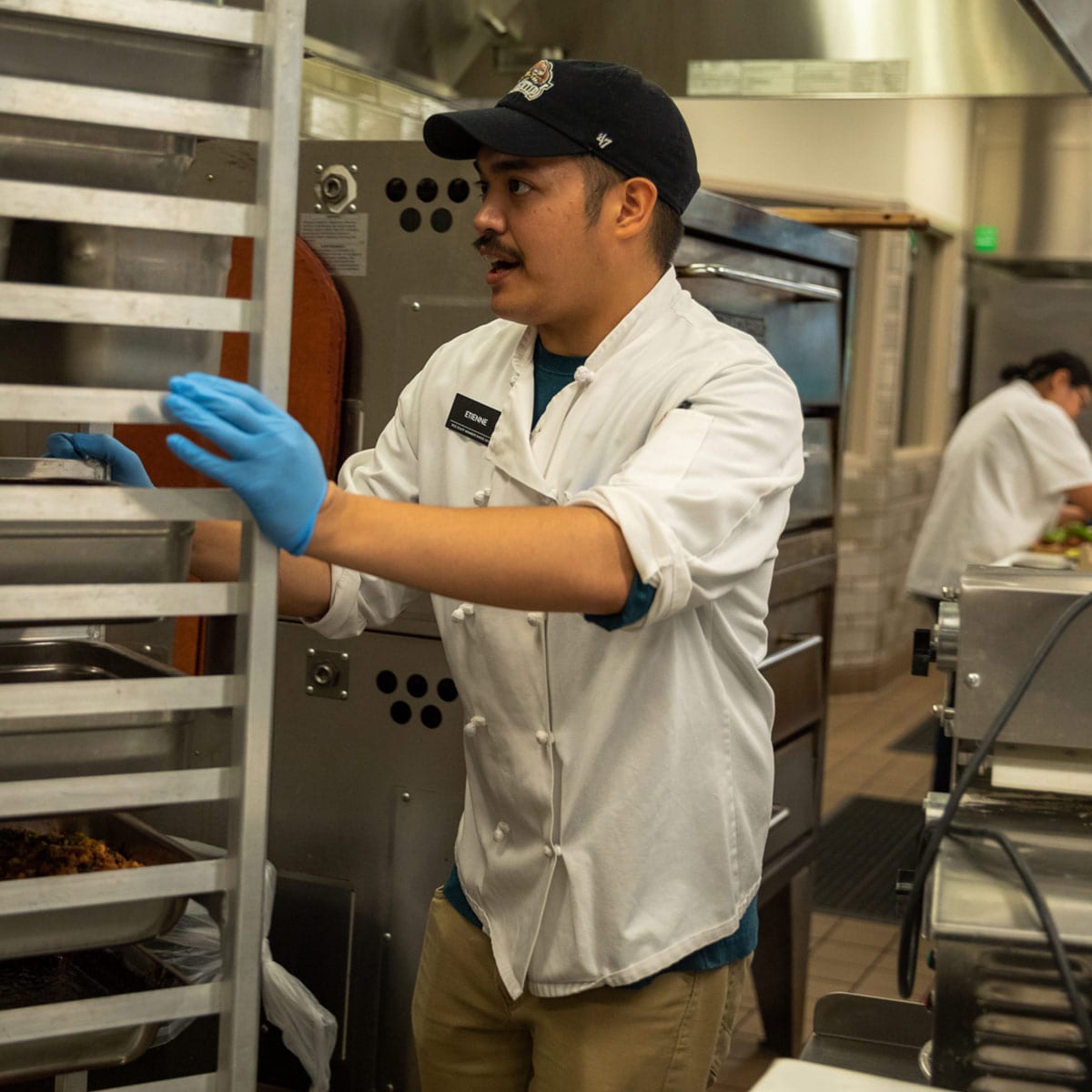 Etienne with trays of food