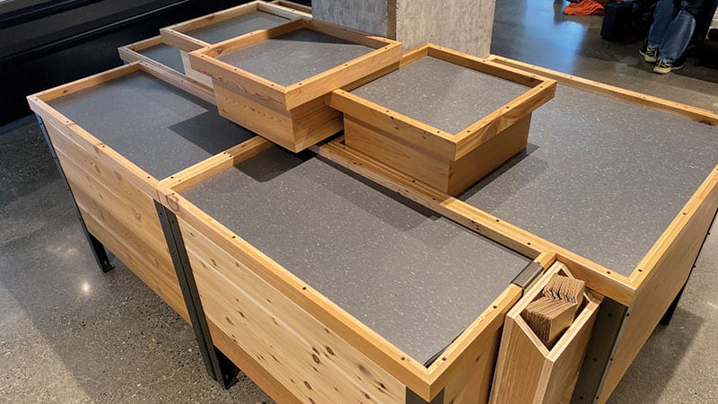 The produce tables at the West Seattle PCC were constructed with reclaimed cedar for the Living Building Challenge.