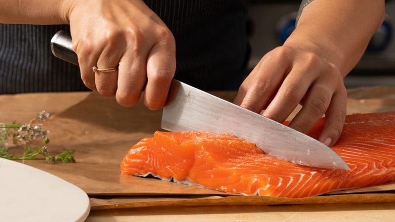 slicing salmon fillet