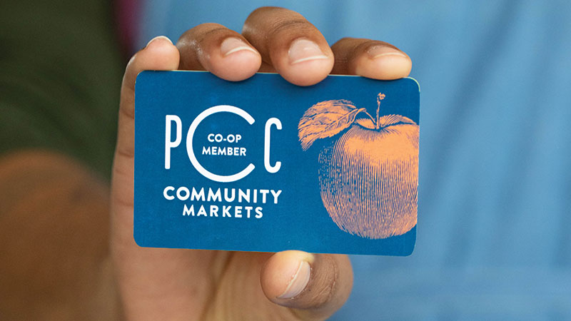 Hand holding PCC Membership card