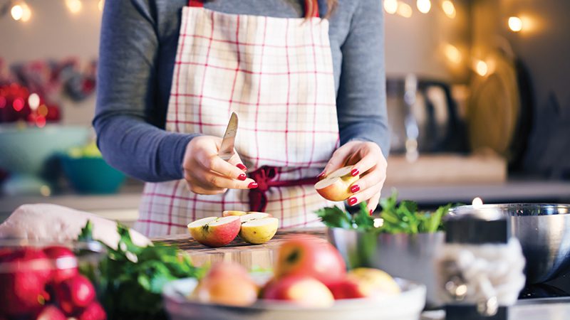 woman cutting apples