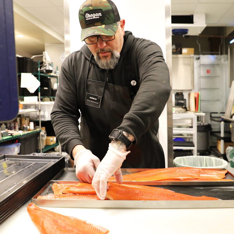 Patricio prepping salmon