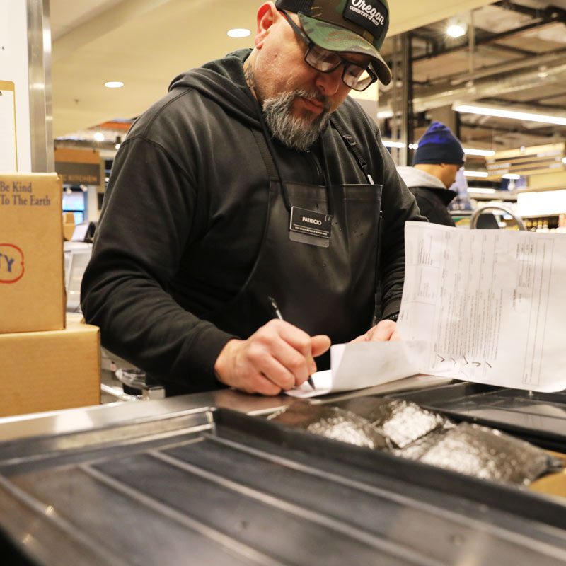 Patricio checking orders