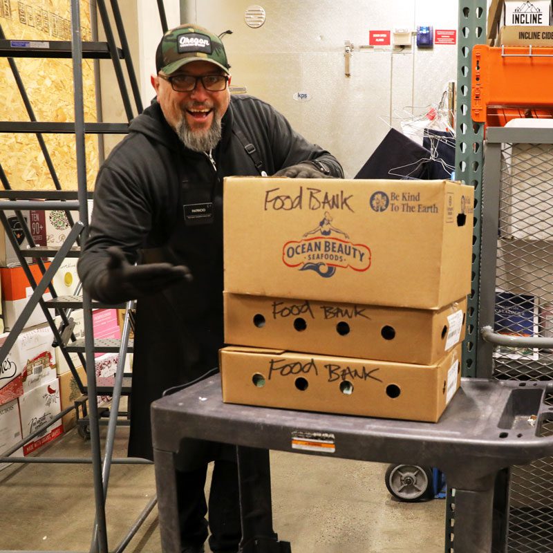 Patricio packing food for the food bank