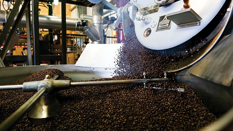 Production facility at Tony's coffee grinding beans, a great way to find value at PCC is by buying your coffee beans in the bulk bins at the co-op.