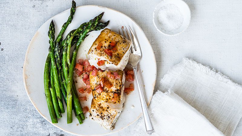 Plate of roasted asparagus with Halibut