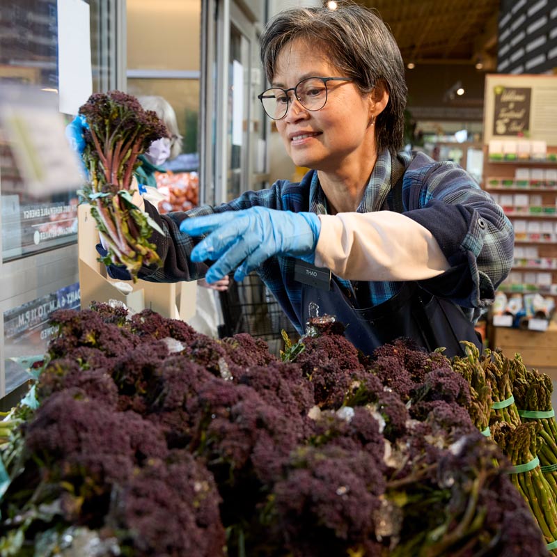 Thao stocking the purple sprouting broccoli