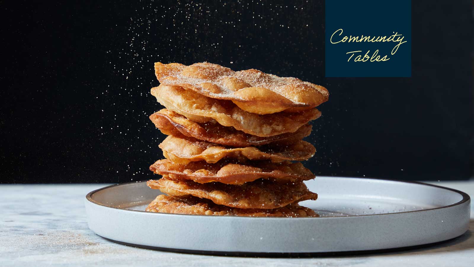 stack of buñuelos on a plate