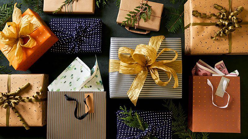 Examples of packages wrapped with sustainable gift wrapping.