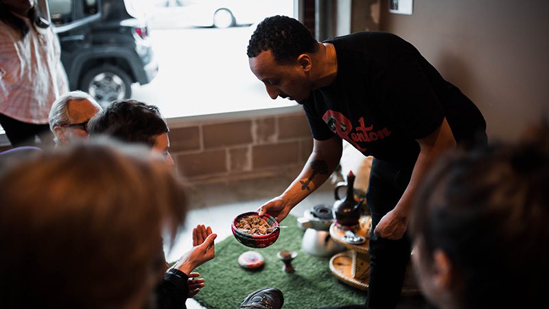 Efrem serving coffee at Boon Boona